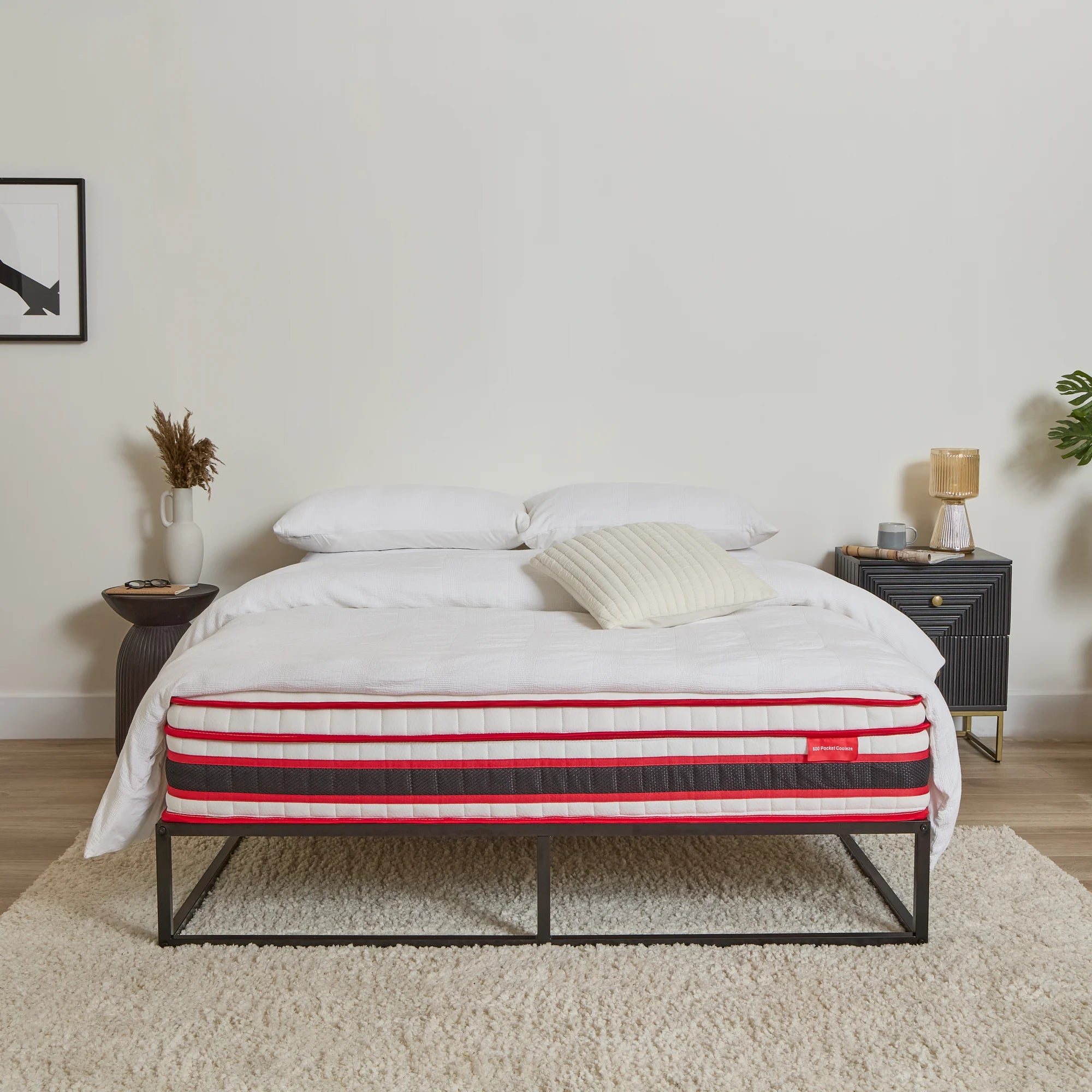 Bed with a EZE striped mattress in a bedroom setting