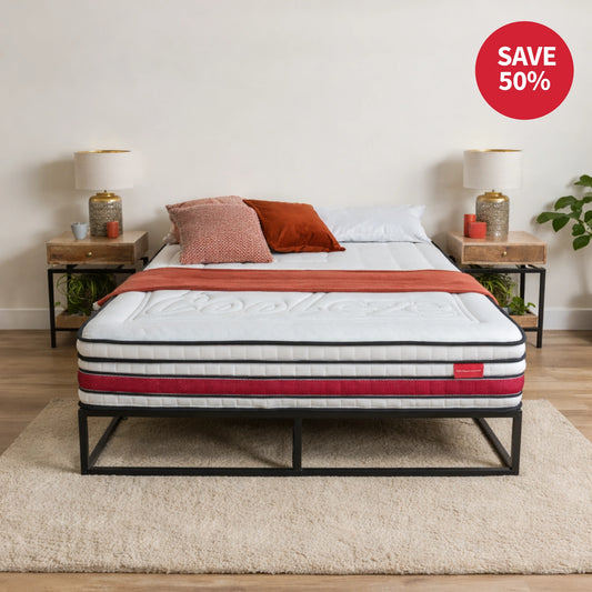 Mattress on a bed with a 'Save 50%' label in a bedroom setting