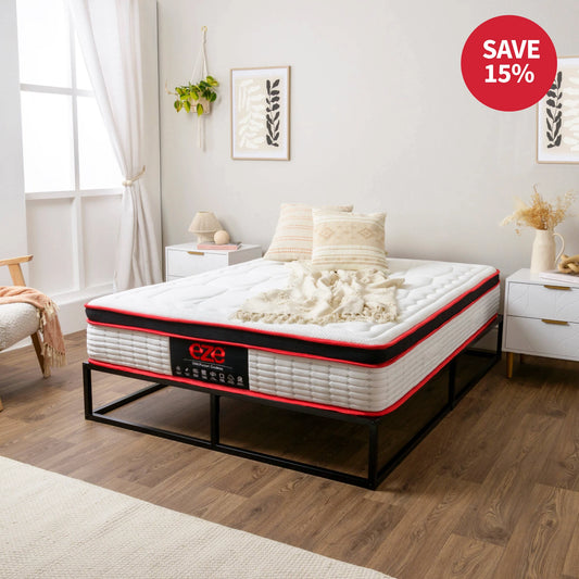 Mattress on a bed frame in a bedroom with a 'Save 15%' label.