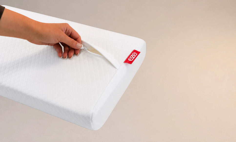 eze comfort pillow with hand unzipping the cover