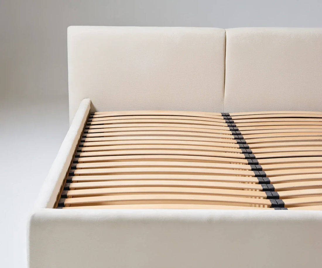 slatted bed frame with cream headboard