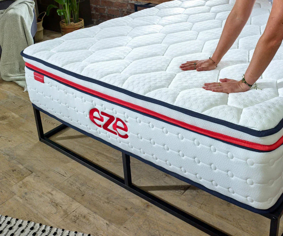 eze hybrid max mattress with womens hands touching the surface