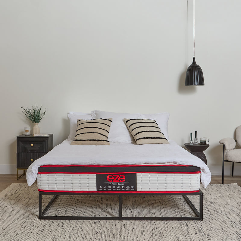 Bed with a mattress labeled 'e7' in a bedroom setting.