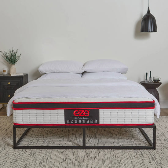 COOLEZE HYBRID PLATINUM MATTRESS WITH EZE LOGO IN A STYLED NEUTRAL ROOM WITH BLACK ACCESSORIES
