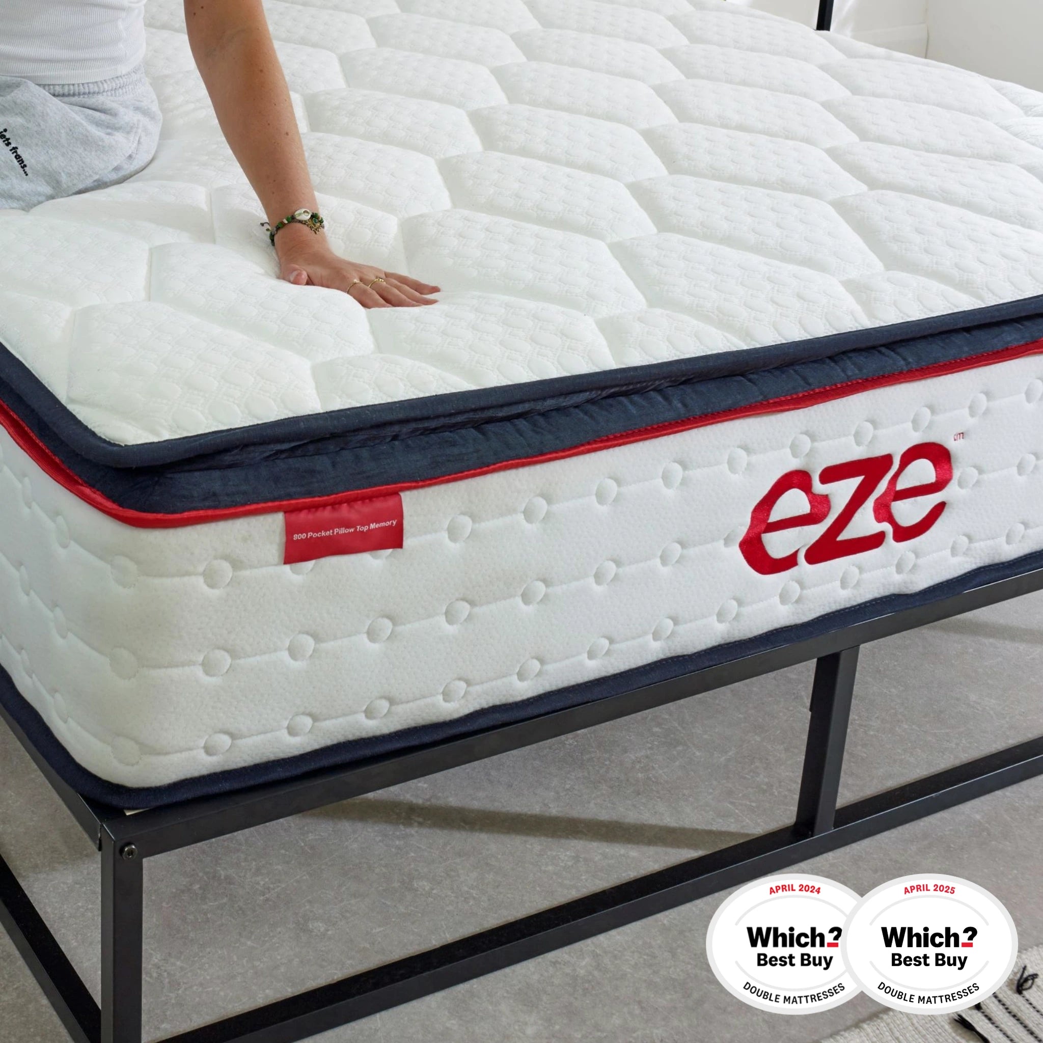 Mattress with 'eze' branding on a metal frame, featuring Which? Best Buy logos.