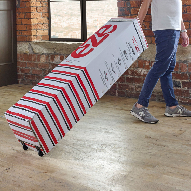 EZE_HYBRID_MATTRESS_BOX_BEING_PULLED_ALONG_ON_WHEELS_BY_MAN_GRABBING_HANDLE