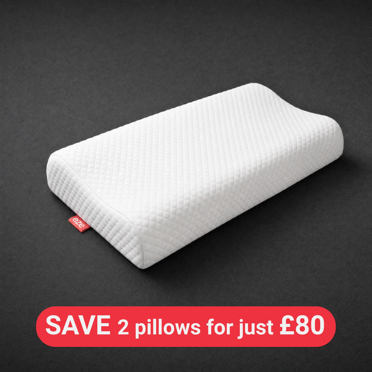White eze comfort memory foam pillow with a red eze tag on a dark gray background