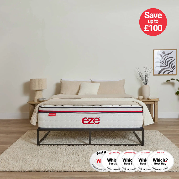 Eze mattress on a bed in a bedroom with 'Save up to £100' and award badges displayed.