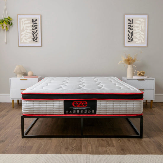 Mattress with 'Eze' branding on a wooden floor in a room setting.
