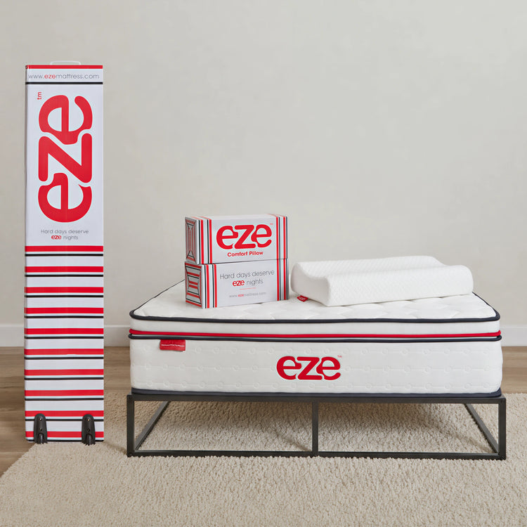 Eze mattress and pillow packaging on a neutral background