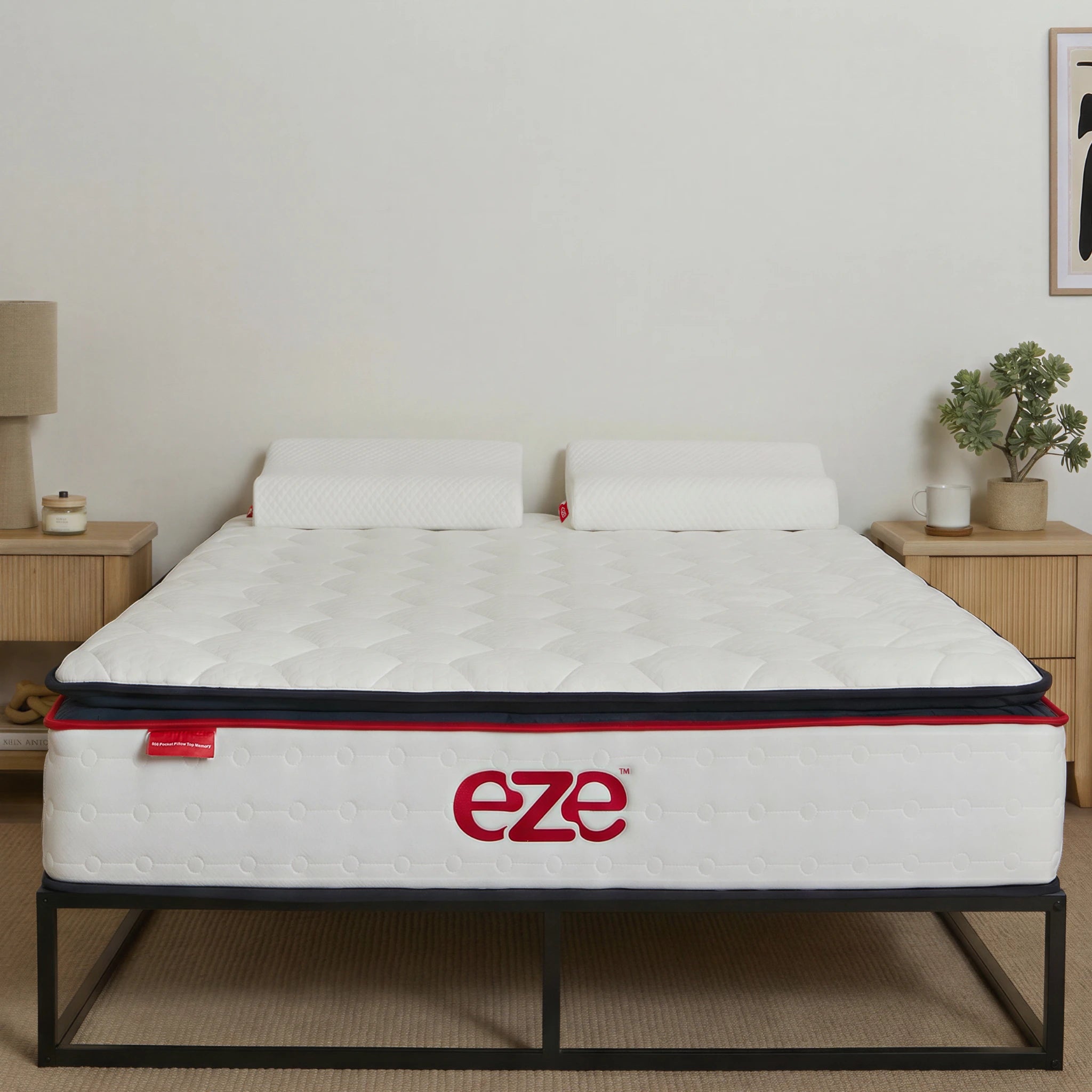 eze hybrid ultra Mattress with 'eze' pillows on the mattress in a room setting