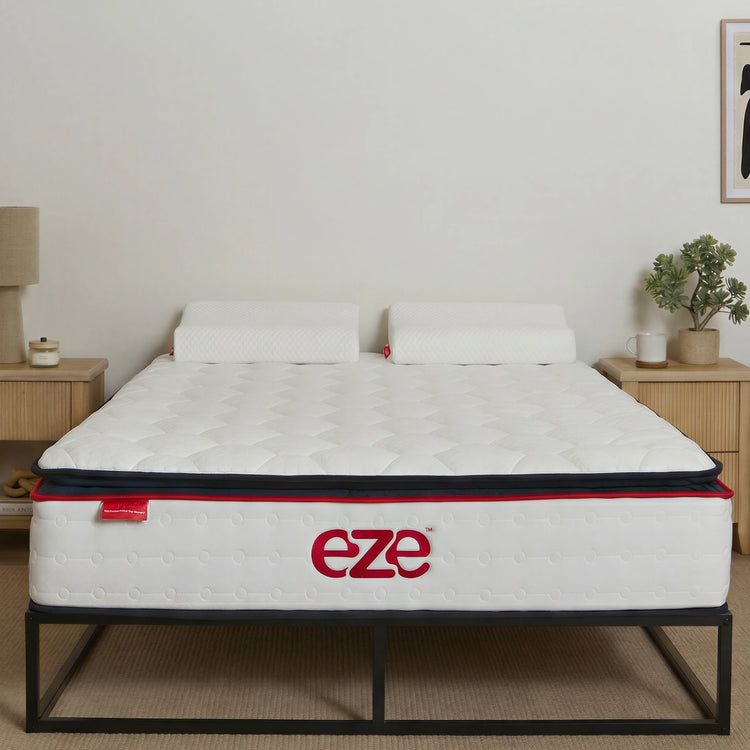 eze hybrid ultra Mattress with 'eze' pillows on the mattress in a room setting