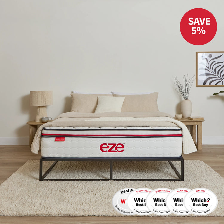 Mattress on a bed frame with 'eze' branding in a bedroom setting, featuring awards below.