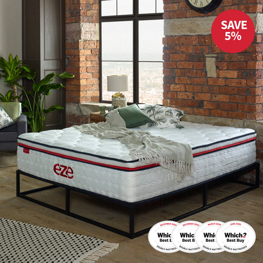 eze hybrid max mattress on a black metal bedframe with underbed storage against an exposed brick wall with 4 which logosand a 5% off red logo